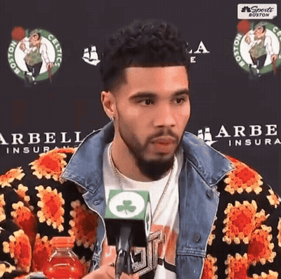 Man In Floral Jacket Talking Into Microphone GIF