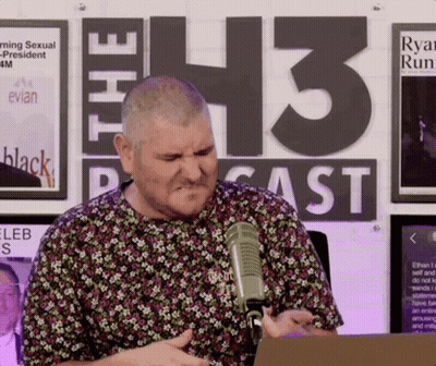 Man in Floral Shirt at Microphone The 43 Podcast