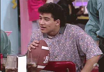 Man In Floral Shirt Holding Football GIF