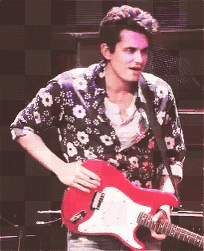 Man In Floral Shirt Playing Red Guitar GIF