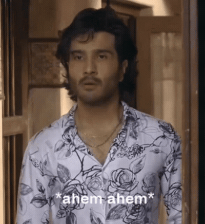 Man in Floral Shirt Saying Ahem Ahem
