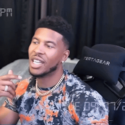 Man In Floral Shirt Sitting In Front Of Tertagear Chair GIF
