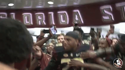 Man In Florida State Jersey Surrounded By Fans GIF