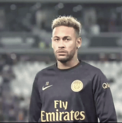 Man In Fly Emirates Jersey Looks At Camera GIF