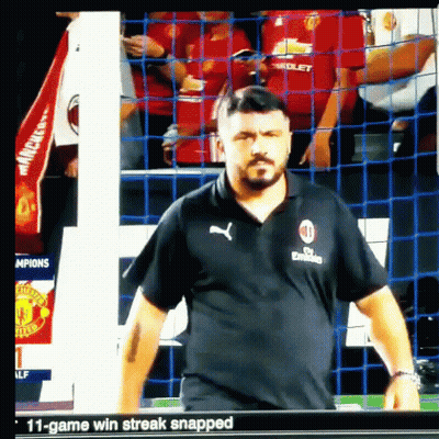 Man In Fly Emirates Shirt Standing In Front Of Net GIF