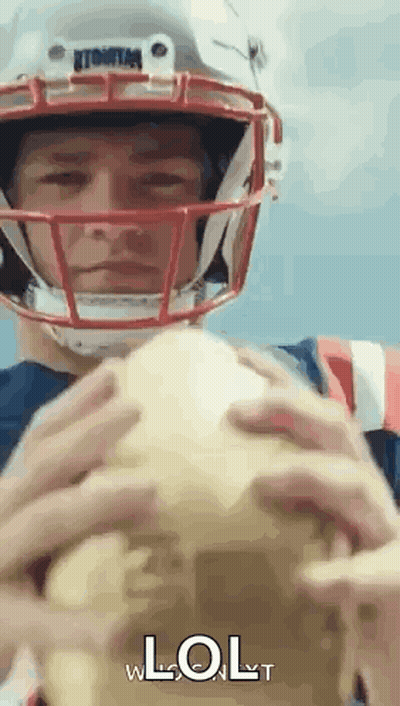 Man In Football Helmet Holding Football Saying LOL GIF