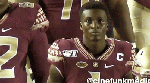 Man In Football Jersey With Letter C GIF