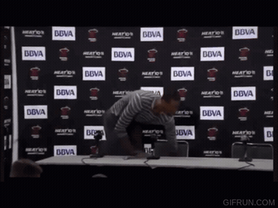 Man In Front Of BBVA Logo Wall GIF