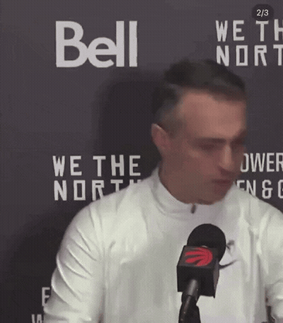 Man In Front Of Bell Sign GIF