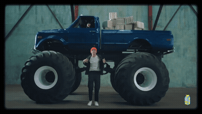 Man In Front Of Blue Monster Truck And Milk Carton GIF