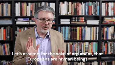Man In Front Of Bookshelf Says Let's Assume For The Sake Of Argument GIF