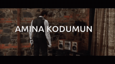 Man In Front Of Brick Wall Amina Kodumun GIF