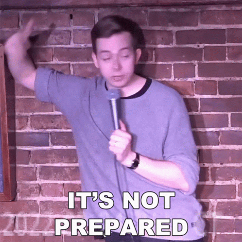 Man In Front Of Brick Wall Holding Microphone Saying It's Not Prepared GIF