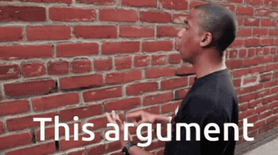 Man In Front Of Brick Wall Saying This Argument GIF