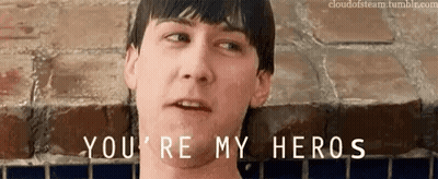 Man In Front Of Brick Wall Saying You're My Heros GIF
