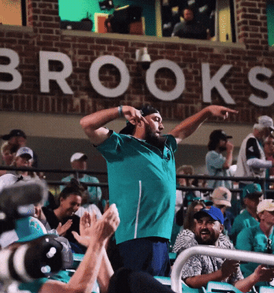 Man In Front Of Brooks Sign GIF