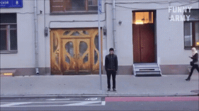 Man In Front Of Building Saying Funny Army GIF