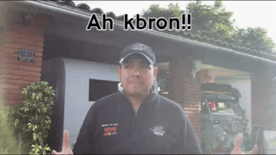 Man In Front Of Building With Ah Kbron GIF