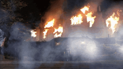 Man In Front Of Burning Building GIF