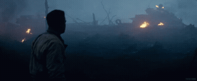 Man In Front Of Burning Building With Word Tech GIF