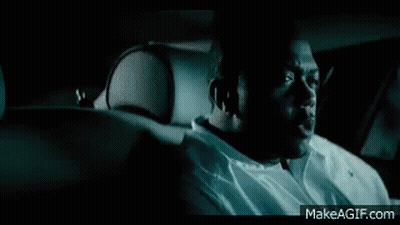 Man In Front Of Car With Lights On GIF