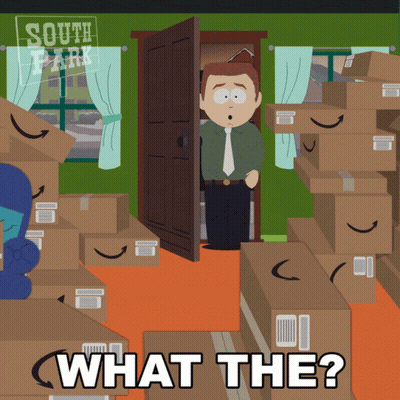 Man In Front Of Cardboard Boxes Saying What The GIF