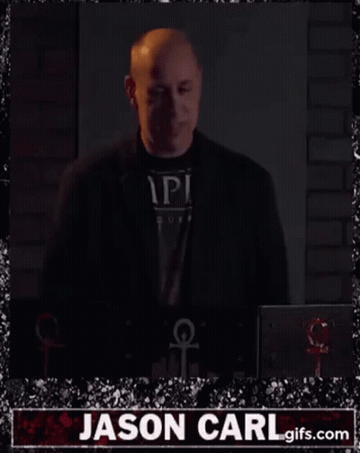 Man In Front Of Cazoo And EToro Ads GIF