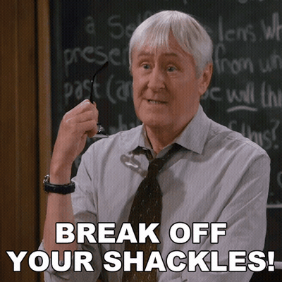 Man In Front Of Chalkboard Saying Break Off Your Shackles GIF