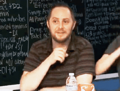 Man In Front Of Chalkboard Saying Strange Artifact GIF