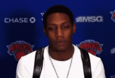 Man In Front Of Chase And Msg Logos GIF