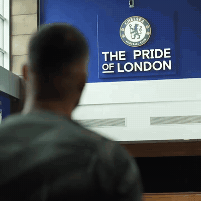 Man In Front Of Chelsea FC Sign GIF
