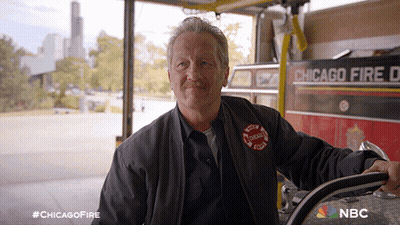 Man In Front Of Chicago Fire Department Vehicle GIF