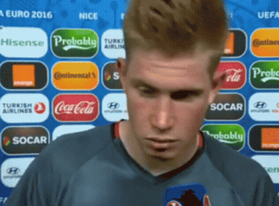 Man In Front Of Coca Cola And Socar Logos GIF