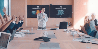 Man In Front Of Conference Room With Netflix Advertisement GIF