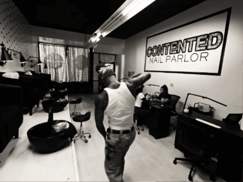 Man In Front Of Contented Nail Parlor GIF