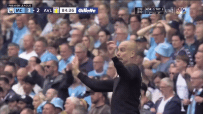 Man In Front Of Crowd With Gillette Logo GIF