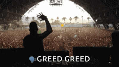 Man in Front of Crowd With Greed Greed