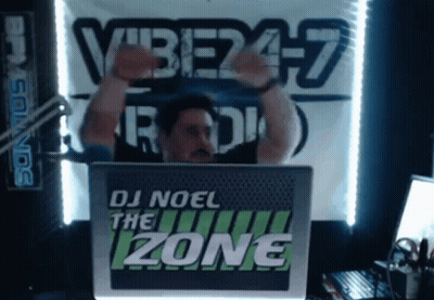 Man In Front Of DJ Noel The Zone Sign GIF