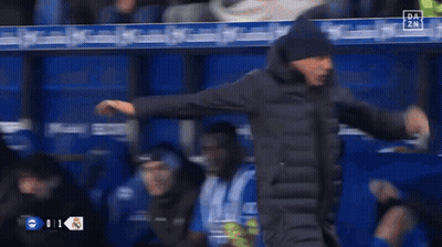 Man In Front Of El Corre Banner GIF