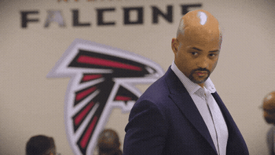 Man In Front Of Falcons Logo GIF
