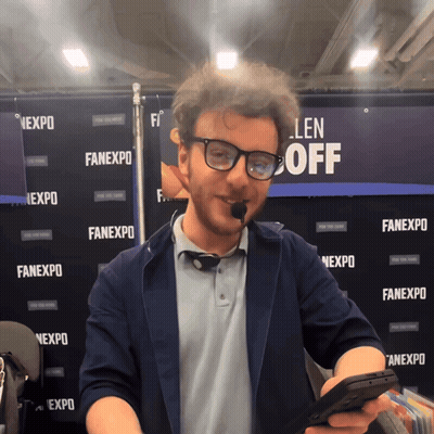 Man In Front Of Fanexpo Wall GIF