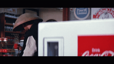 Man In Front Of Fanta Sign GIF