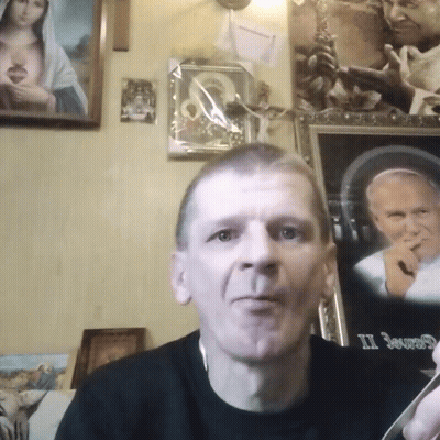 Man In Front Of Framed Picture Saying II GIF