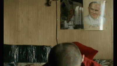 Man In Front Of Framed Picture Saying II GIF