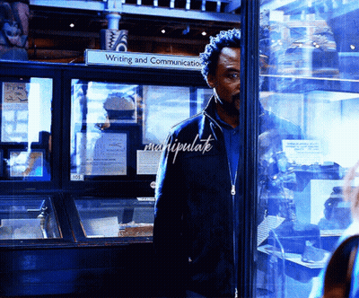 Man In Front Of Glass Display Case Saying Writing And Communication GIF