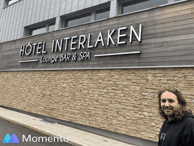 Man In Front Of Hotel Interlaken Lounge Bar & Spa Sign GIF