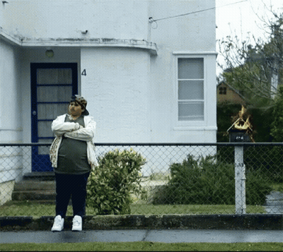 Man In Front Of House Number 4 GIF