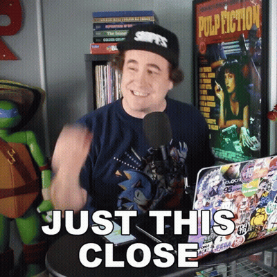 Man In Front Of Laptop Saying Just This Close GIF