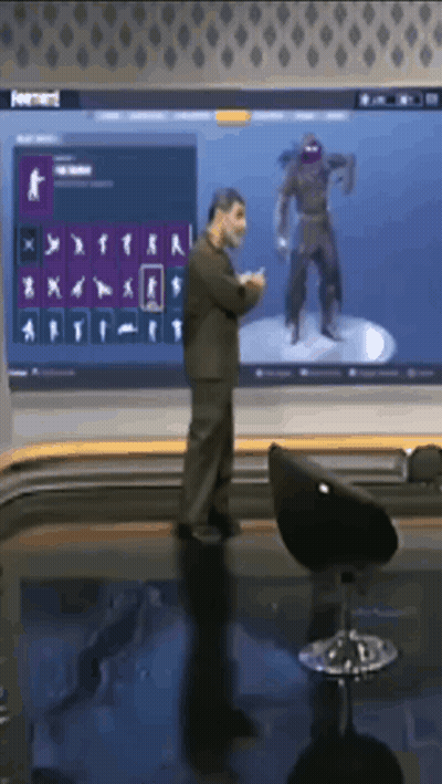 Man In Front Of Large Screen With Ninja GIF