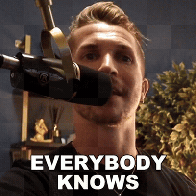 Man in Front of Microphone Saying Everybody Knows